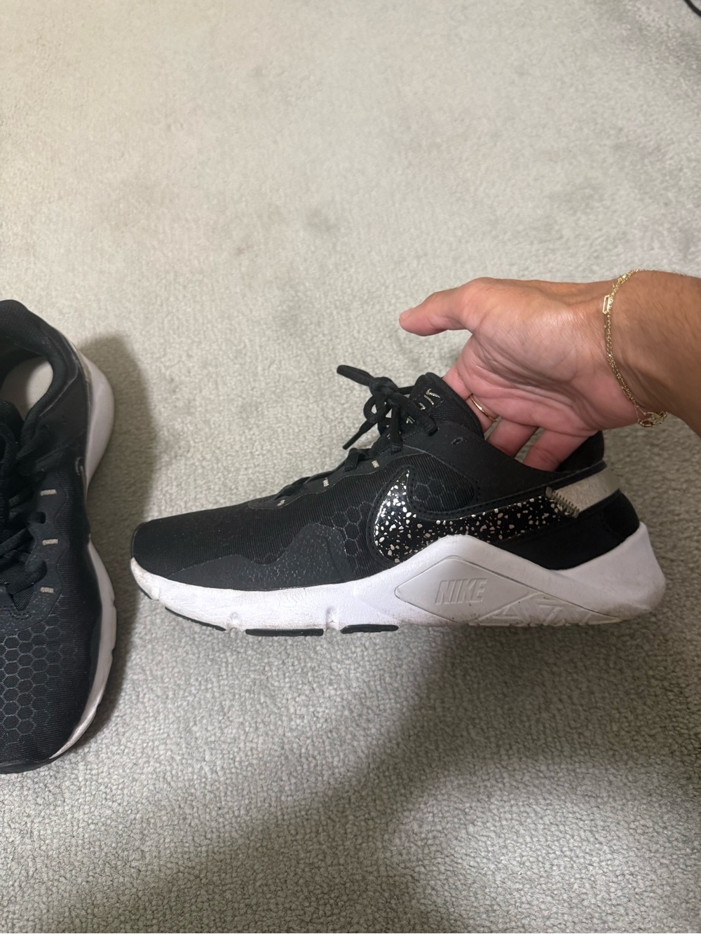 Nike Women’s Black Sneakers with White Sole and Speckled Swoosh
